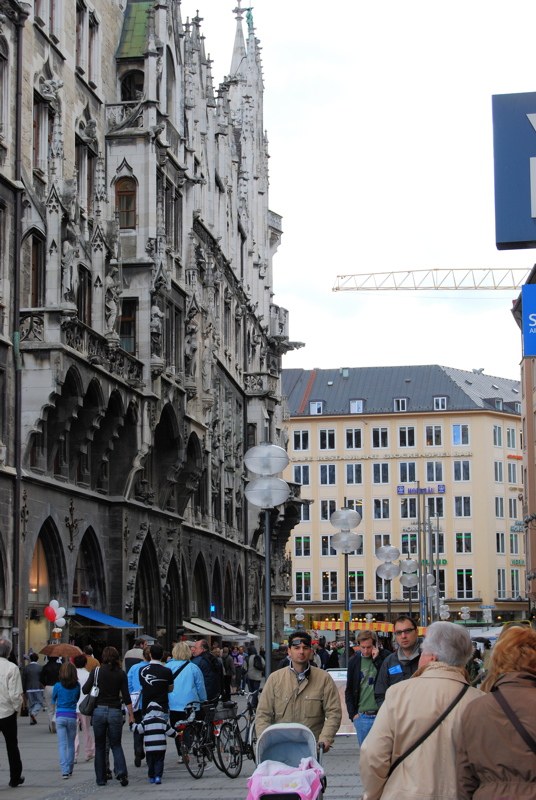 25 - The New Town Hall in the center of Munich's Marienplatz square, a vibrant city landmark featuring grand Gothic Revival